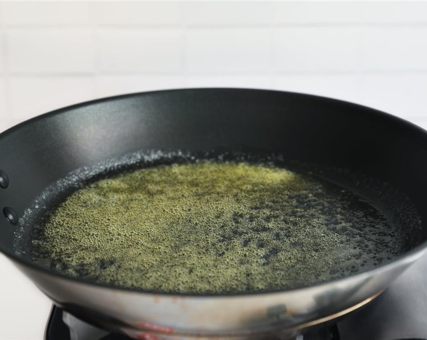 step 6 Swirl butter around to coat the bottom of the pan.