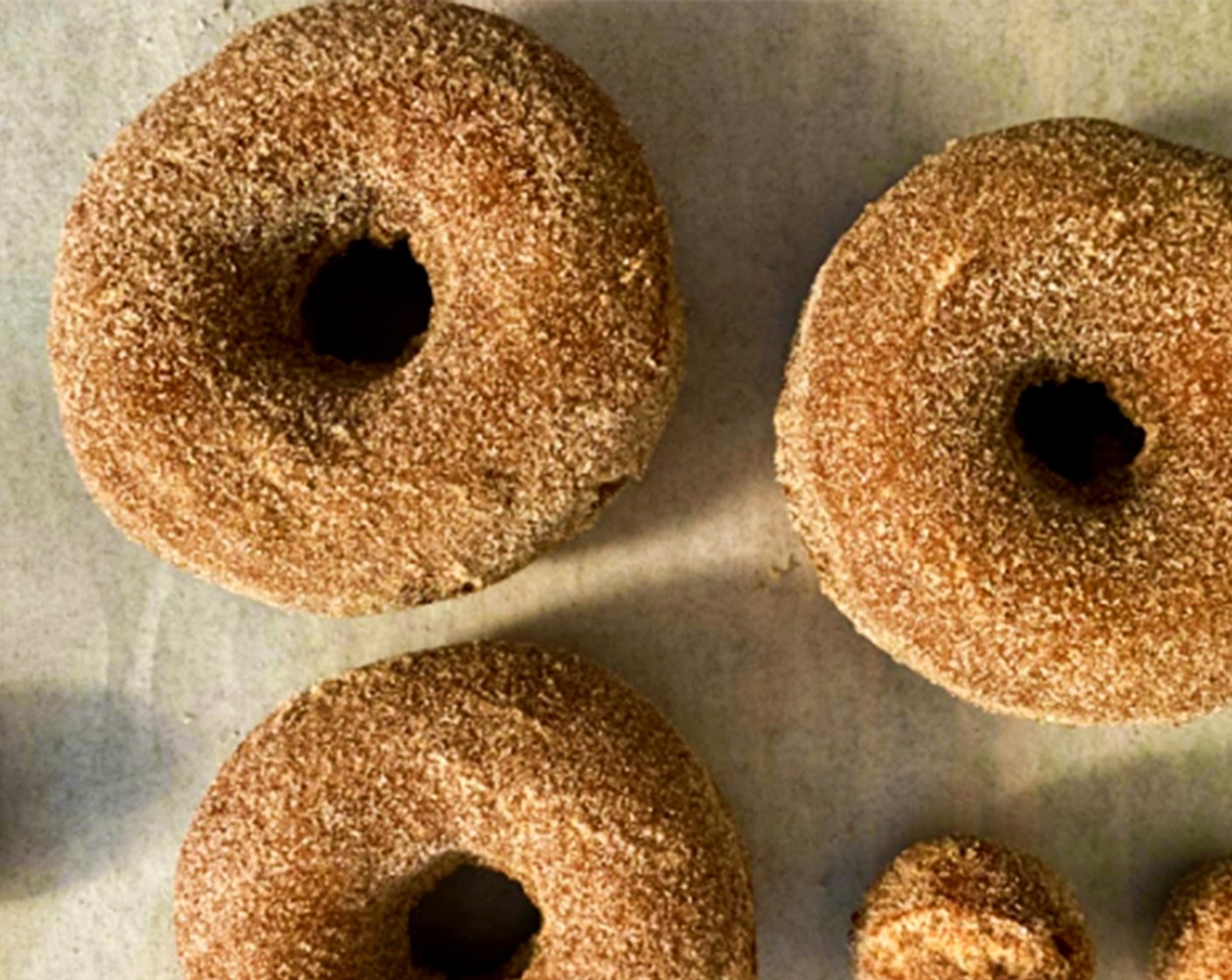 step 11 While the donuts are still warm, put in the sugar topping,coat completely, and enjoy!