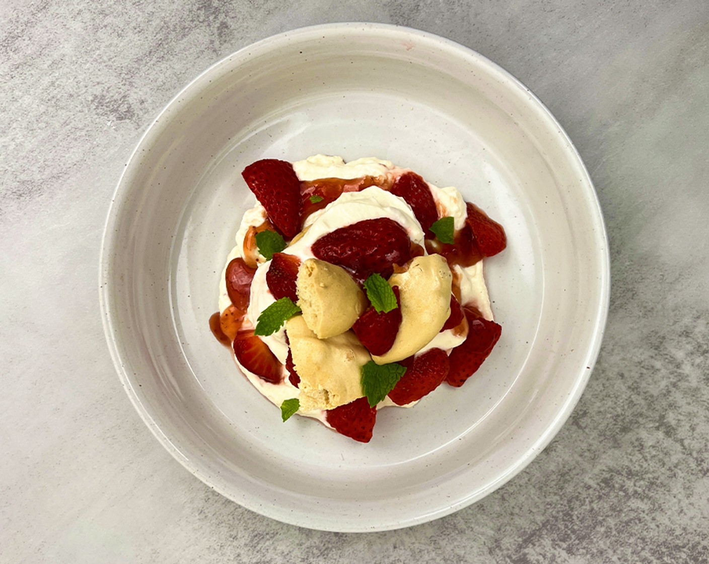 step 4 In a bowl, layer the melted Strawberry Jam (4 tsp) , whipped cream and macerated strawberries, repeat two times. Top with torn Fresh Mint Leaves (to taste).