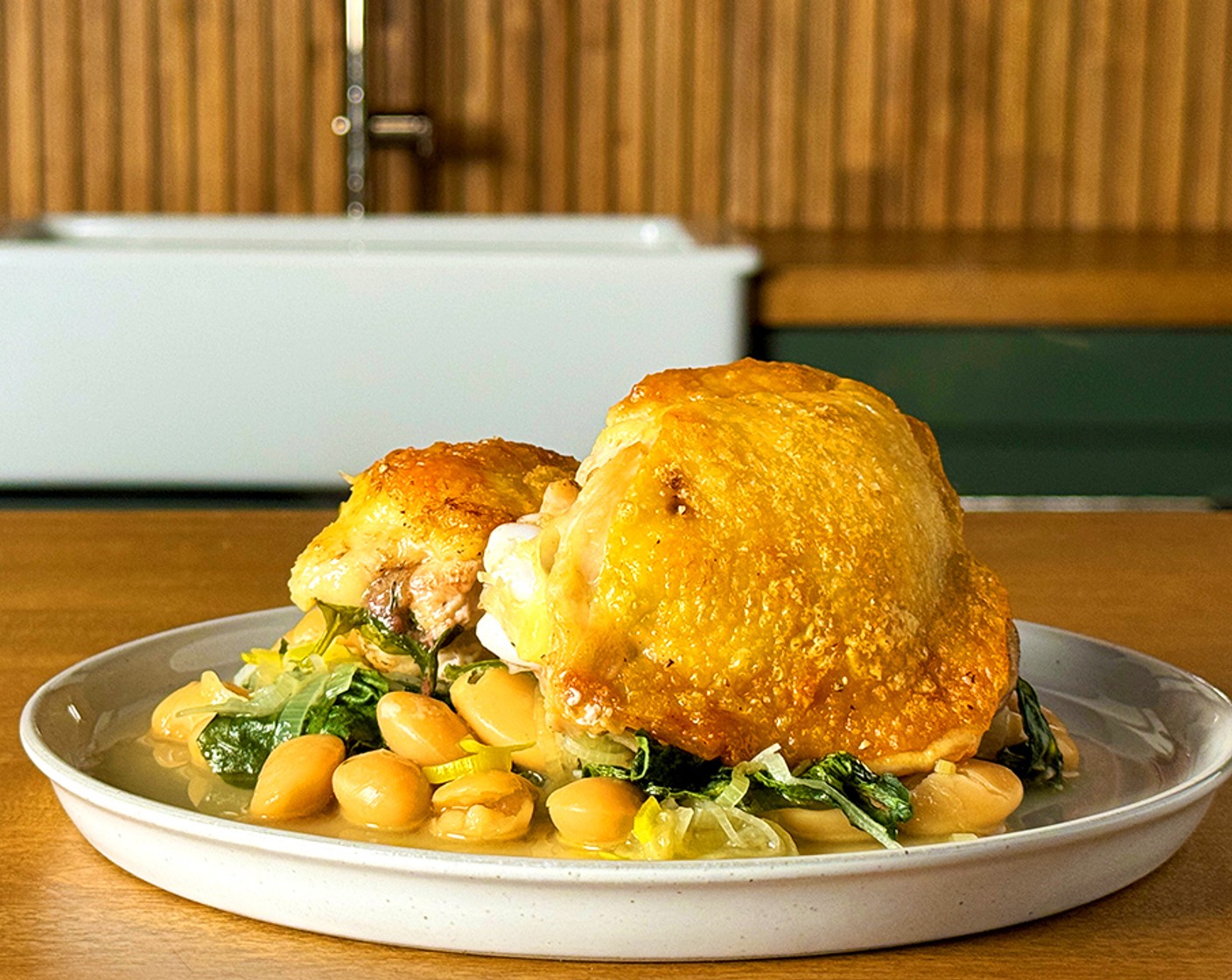 step 7 Serve the chicken and beans with crispy potatoes.