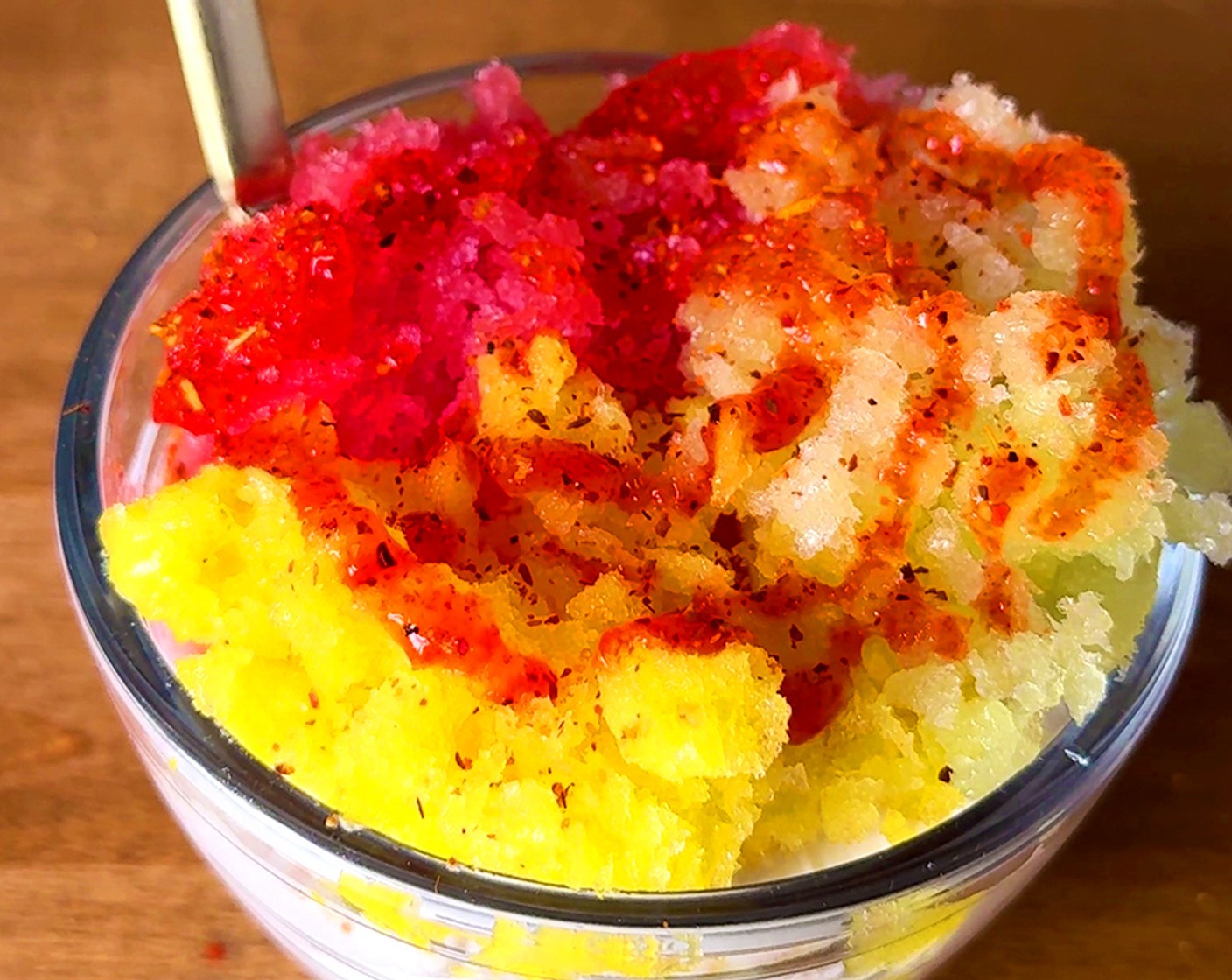 step 5 Assemble: Fill a cup with each of the granita flavors then top with Coconut Whipped Topping (1 Tbsp), Tajin (1 pinch), and Chamoy (1 Tbsp).