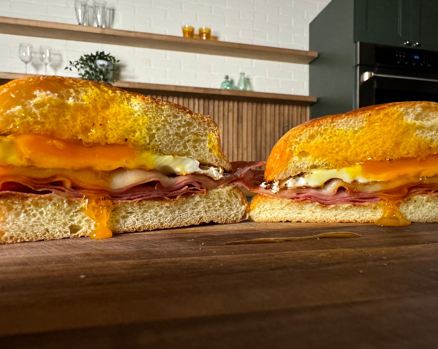 step 4 Assemble the Sandwiches: Mix the Dijon Mustard (4 Tbsp) and remaining Mayonnaise (2 Tbsp). Spread a generous layer on the bottom half of each toasted bun. Layer the stacks of mortadella and melted cheese onto the sauced bun. Top each stack with a fried egg. Place the top bun on each sandwich.