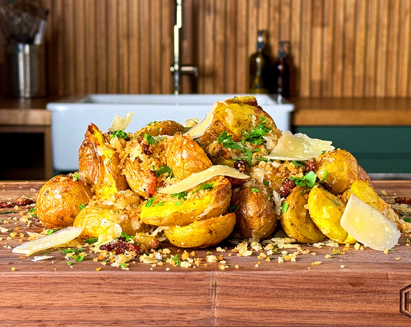 step 4 Finish the potatoes: While the potatoes are still hot, place in a large bowl and season with Ground Black Pepper (to taste).  Mix the potatoes with the Shredded Parmesan Cheese (1/2 cup) and top with the Scallions (to taste), Fresh Parsley (to taste), and Panko Breadcrumbs