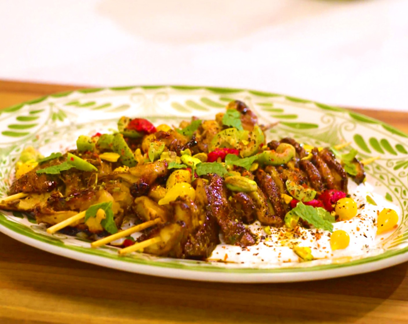 step 5 Assembly: Spread the labneh on a platter and top with the mushrooms skewers. Sprinkle with Roasted Salted Pistachios (to taste), Olives (to taste), Pickled Peppers (to taste), Aleppo Pepper (to taste), Urfa Biber Pepper (to taste), and freshly torn Fresh Mint (to taste).