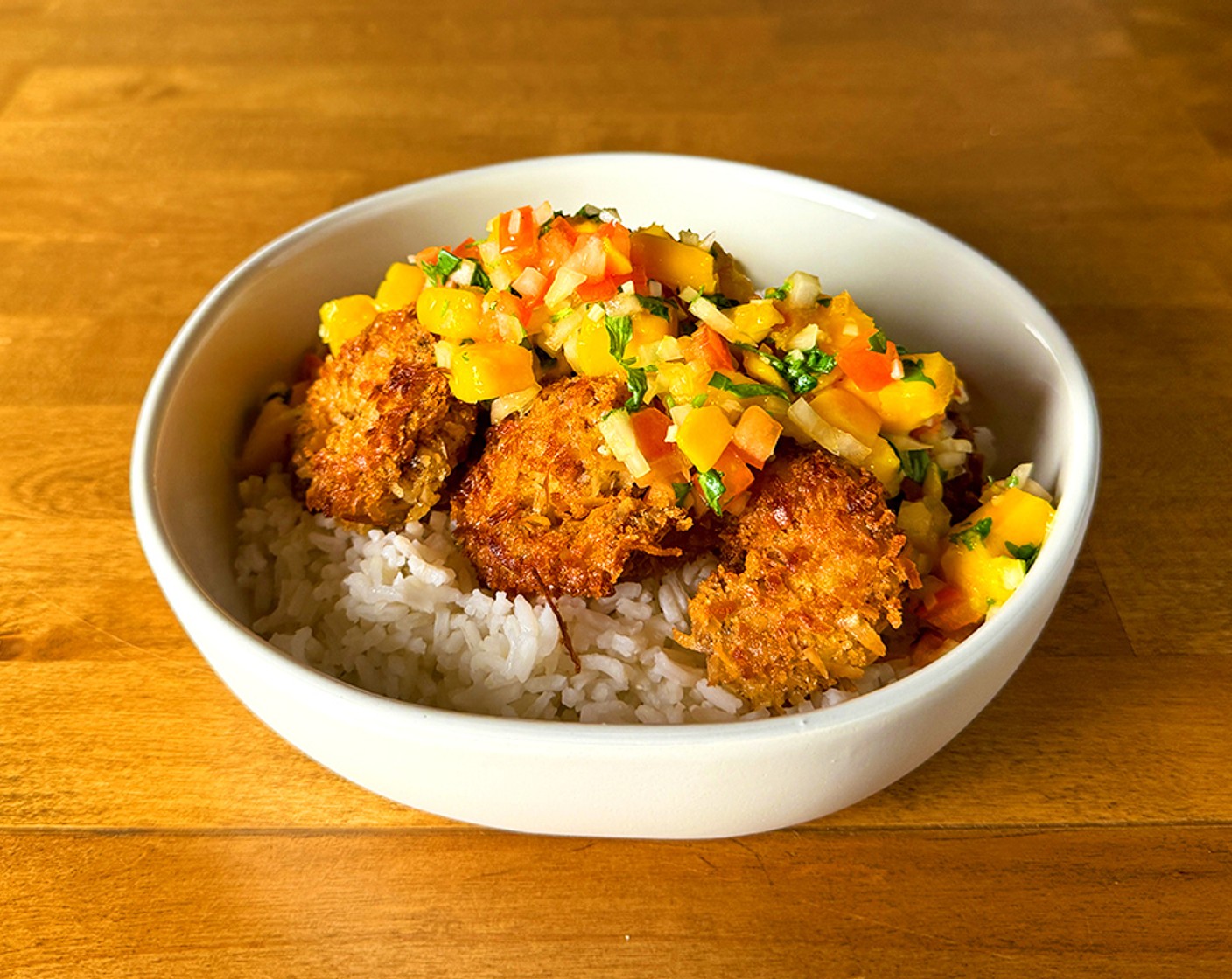 step 9 Serve the coconut shrimp over cooked White Rice (1 cup) and top with the salsa.