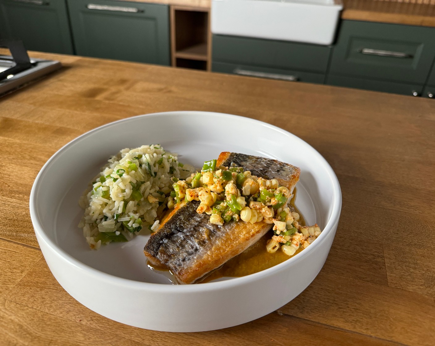 step 9 Spoon the borracho salsa on the plate and place the fish on top. Spoon the corn salsa over the fish and serve with the rice, salsa verde and crispy tortillas.