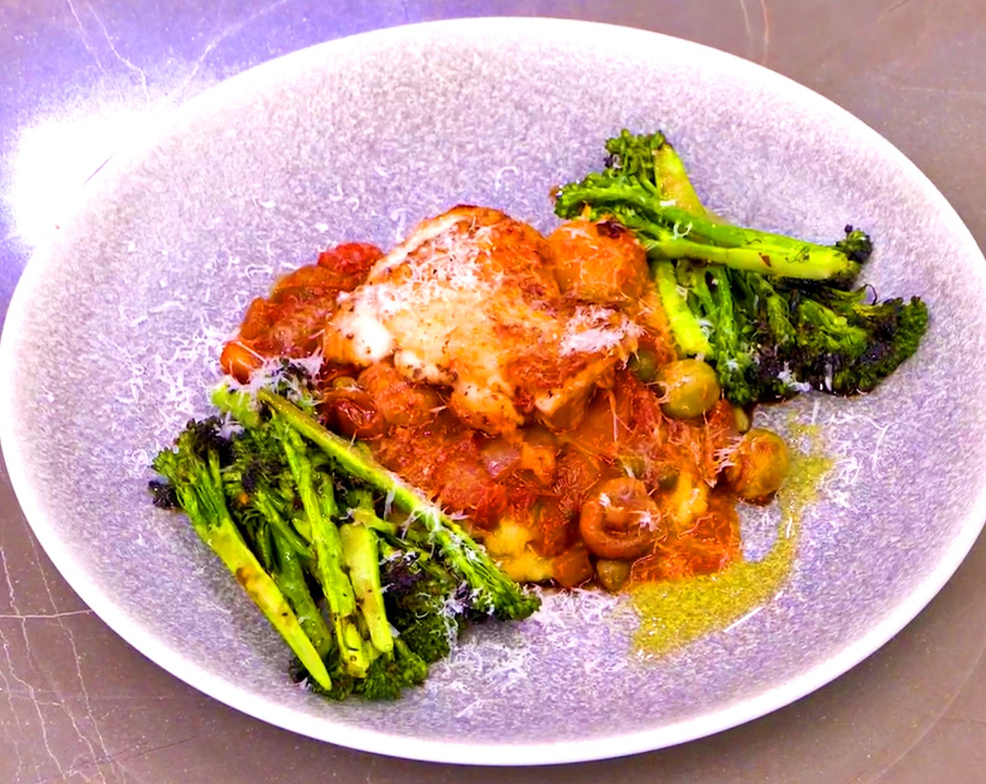 step 18 Serve the chicken cacciatore over the polenta with a side of the grilled broccolini. Drizzle with olive oil and sprinkle with freshly grated parmesan.