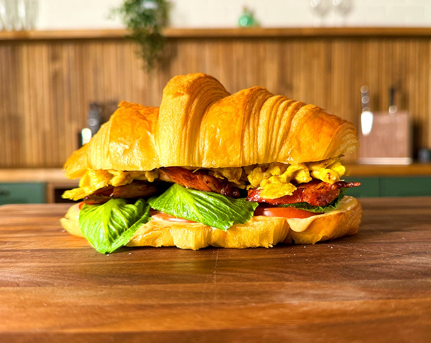 step 14 Lather the toasted sides of the tops of the croissants and place on top of each sandwich.