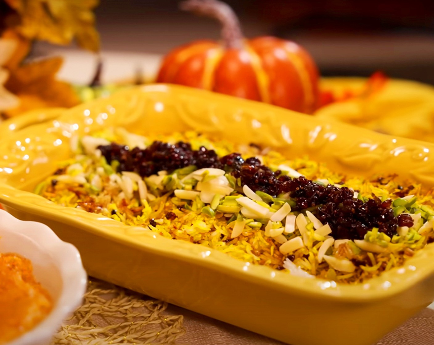 step 15 To plate: drizzle any remaining barberry syrup on the bottom of a plate and top with the remaining cooked rice from the pot. Top with the saffron rice and sprinkle with sour barberries, slivered almonds and pistachios.