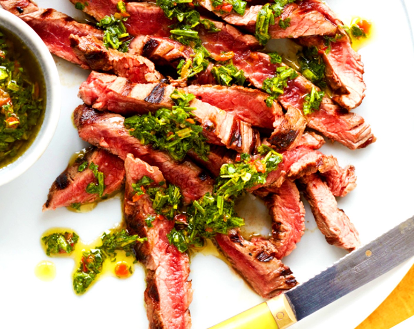 step 6 Slice the steak against the grain into long, thin slices and arrange the slices on a serving platter. Drizzle with a generous amount of chimichurri sauce and serve with the mushrooms, tomatoes and Watercress (as needed).