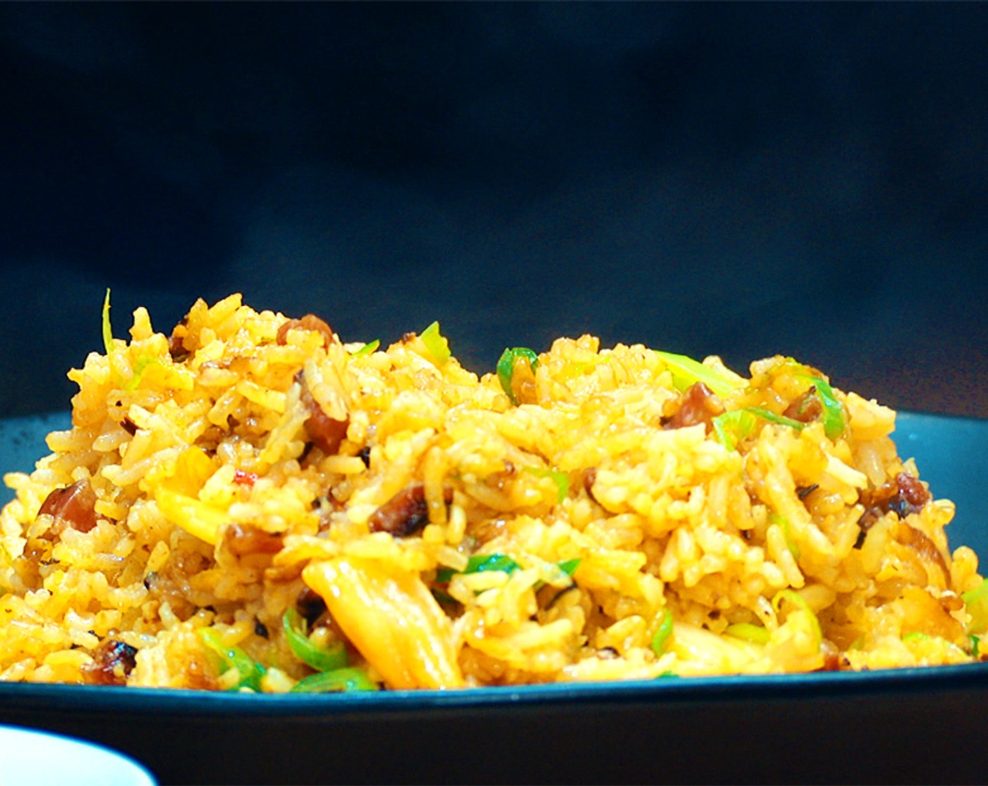 step 9 Plate the rice with the egg on top and finish with the remaining Scallion (1/2 bunch).