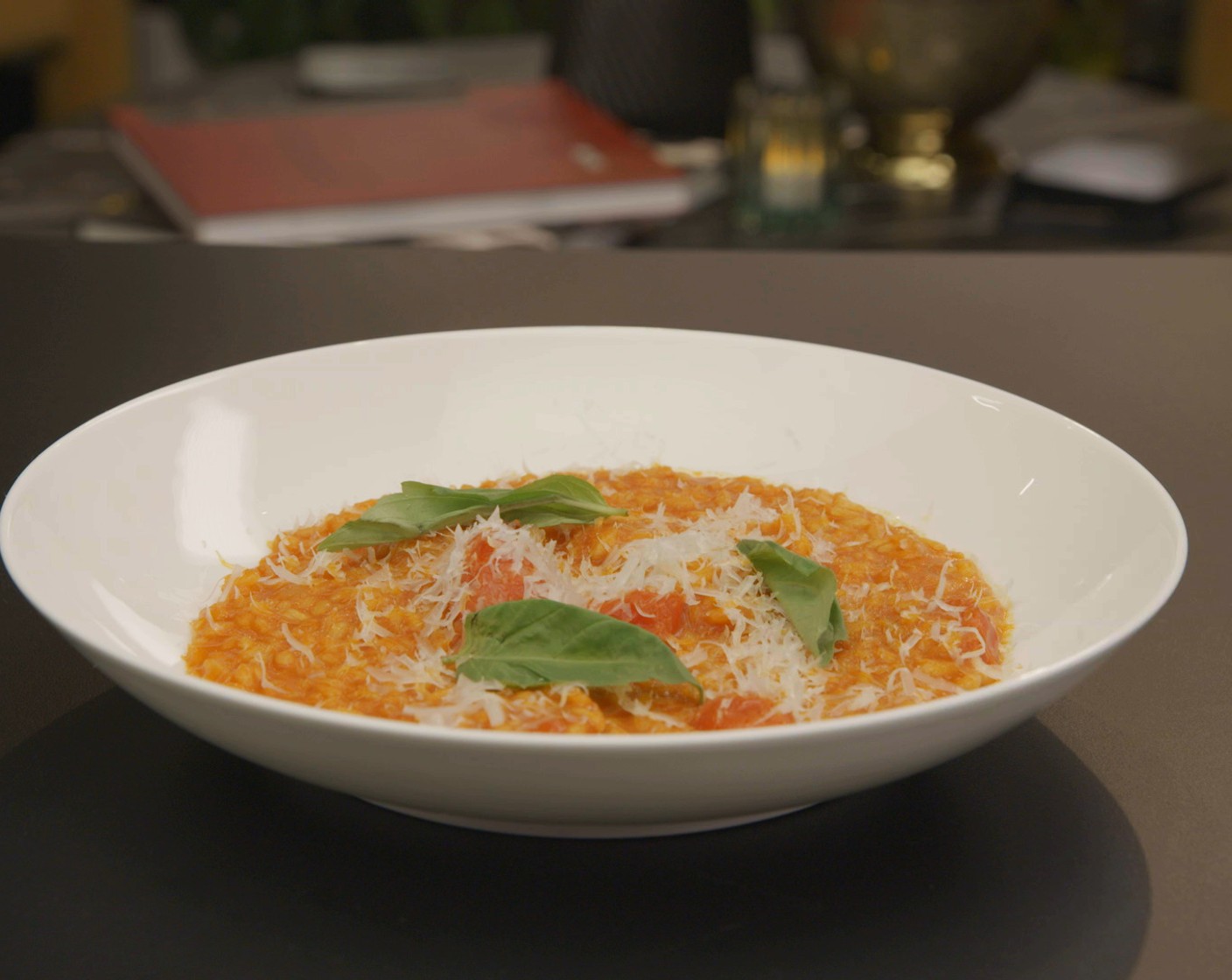 step 5 Remove the pan from the heat and beat in half of the Vegan Parmesan Cheese (1/4 cup). Fold in the roast cherry tomatoes and Fresh Basil Leaf (1 handful), then spoon into warm bowls. Top with the remaining cheese and serve.