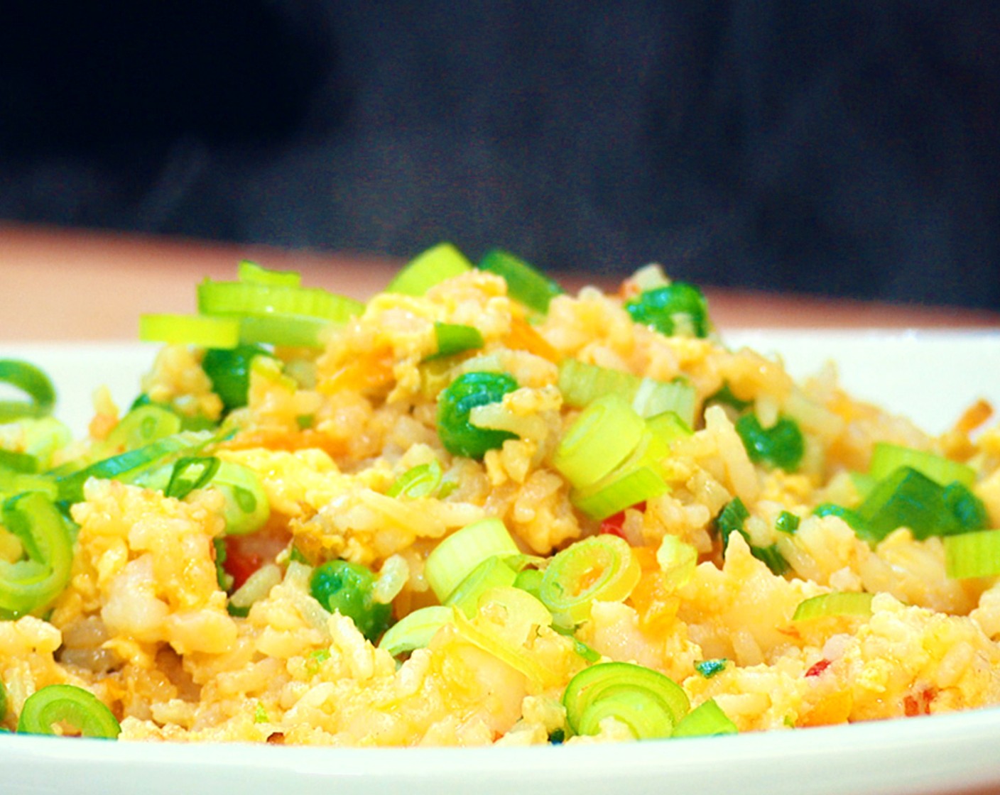 step 5 Plate the rice and finish with the remaining Scallion (1/2 bunch). Serve with your favorite Chili Oil (to taste) or chili crisp.