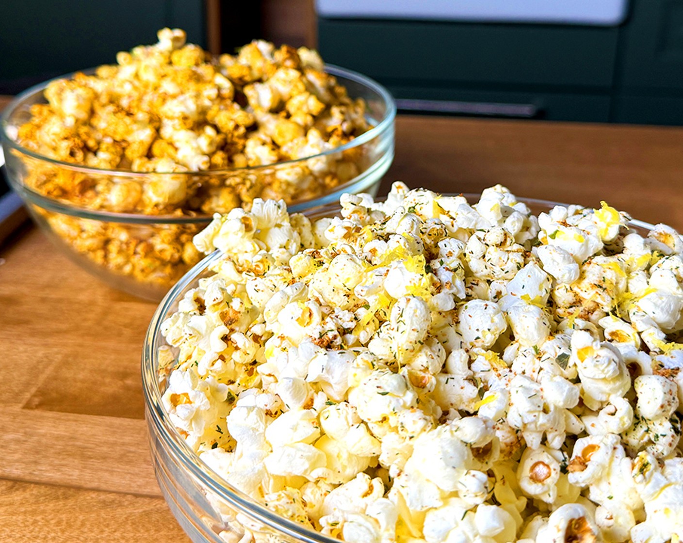 step 4 Place a large pot with a tight fitting lid over medium high heat. Add the Neutral Oil (4 tsp) and 3 kernels of the popcorn. Once the corn pops, add the remaining Popcorn Kernels (1/3 cup) and cover with the lid. Shaking the pan occasionally, let the popcorn cook until the popping subsides, Remove from the heat and add the seasoning mixture. Toss to coat completely then finish with the Cotija Cheese (4 Tbsp) and fresh Lime (1)